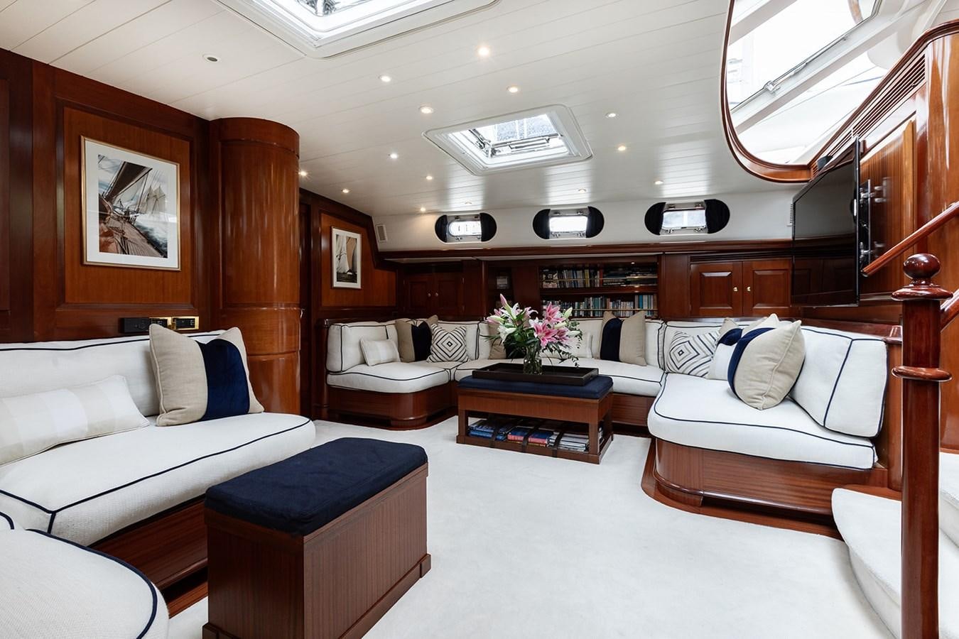 a living room with a couch and a table aboard IRELANDA Yacht for Sale