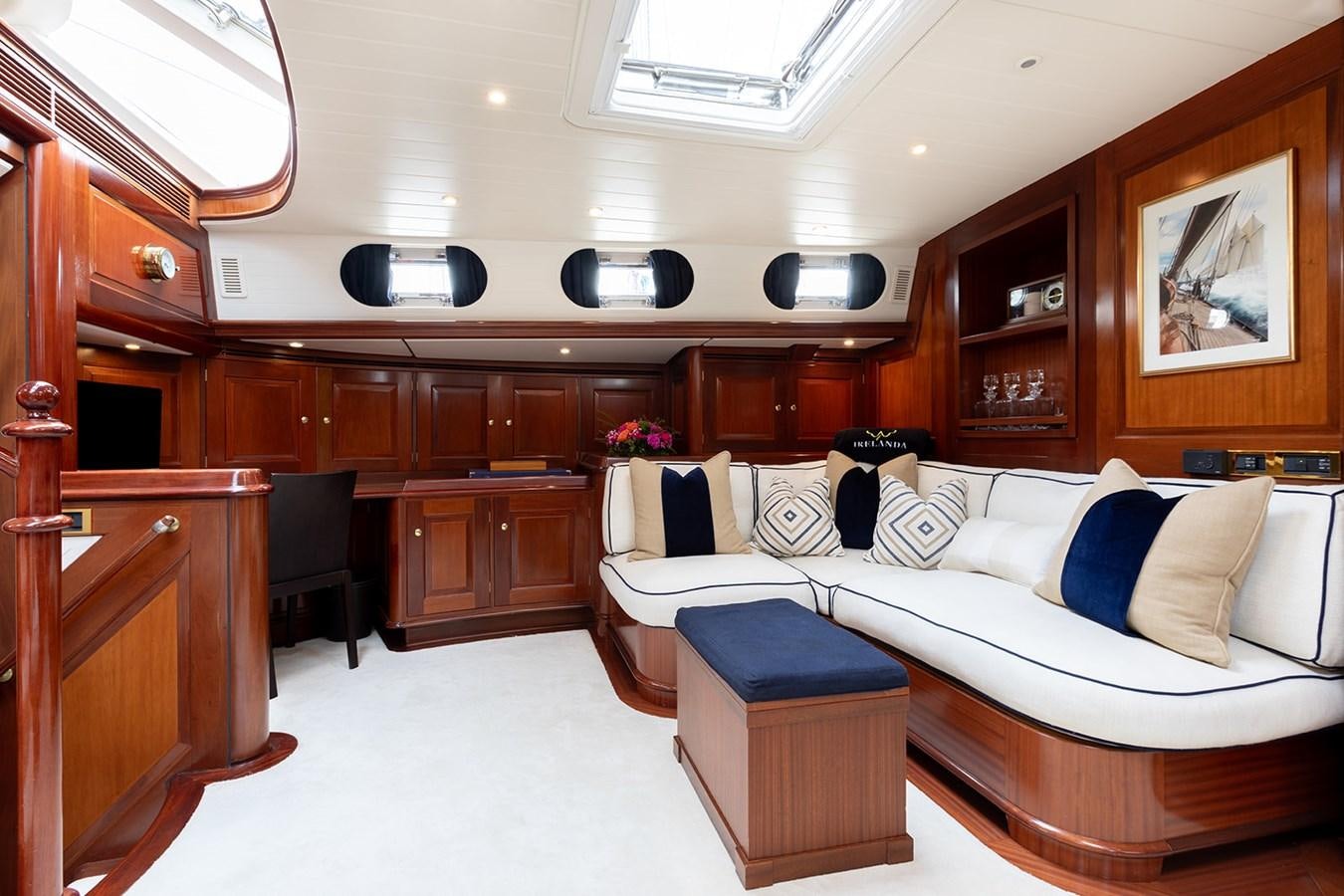 a room with a couch and a table aboard IRELANDA Yacht for Sale