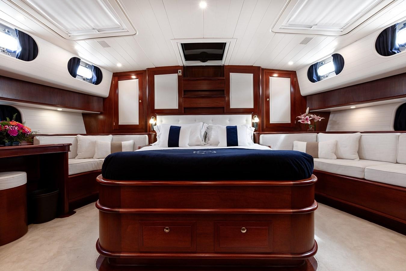 a room with a bed and a couch aboard IRELANDA Yacht for Sale