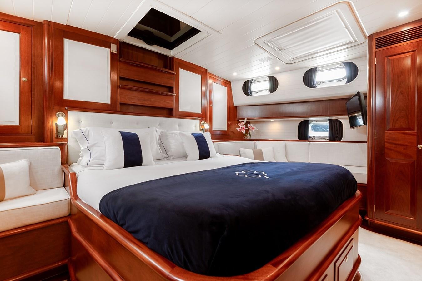 a room with a bed and a couch aboard IRELANDA Yacht for Sale