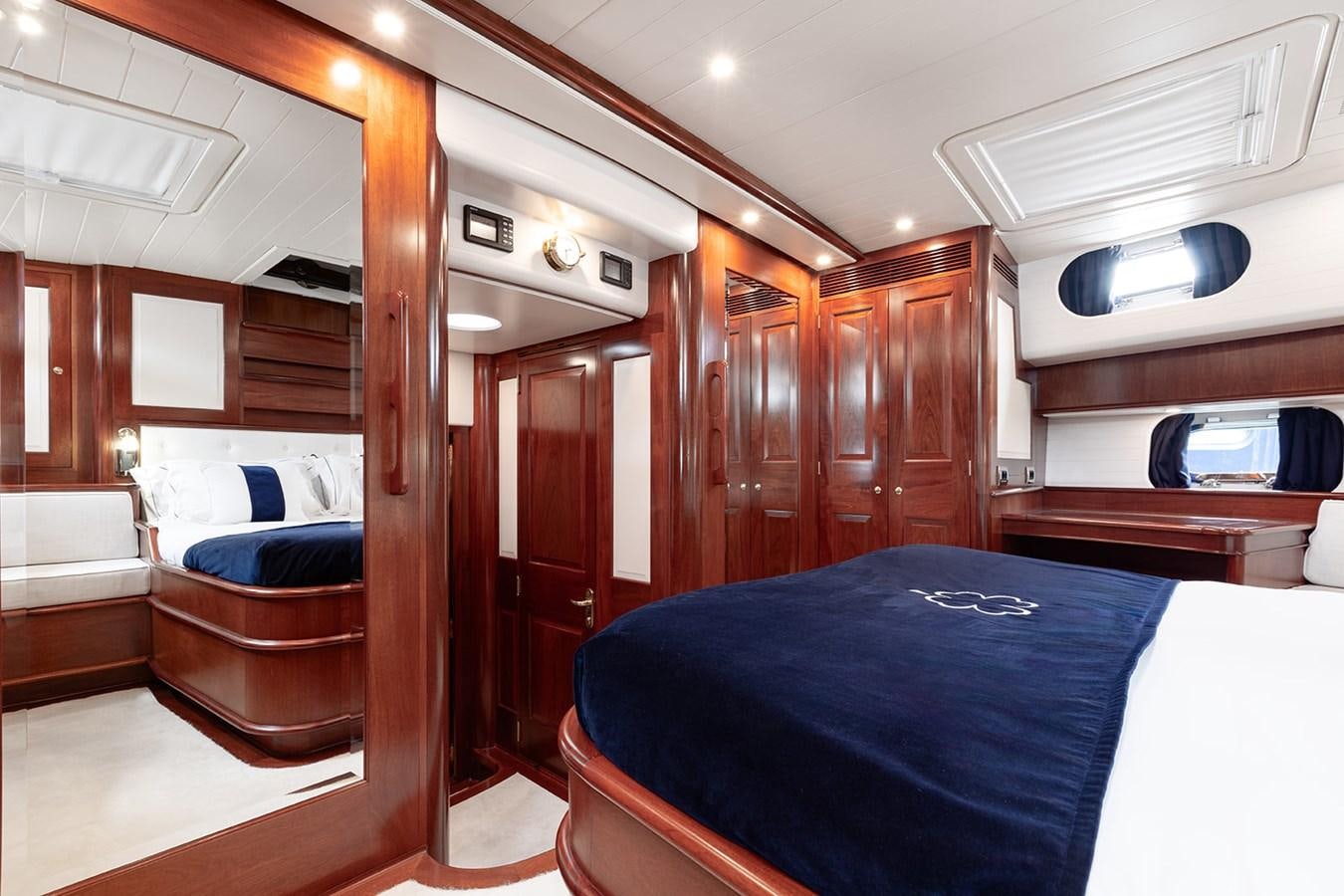 a room with a bed and a chair aboard IRELANDA Yacht for Sale