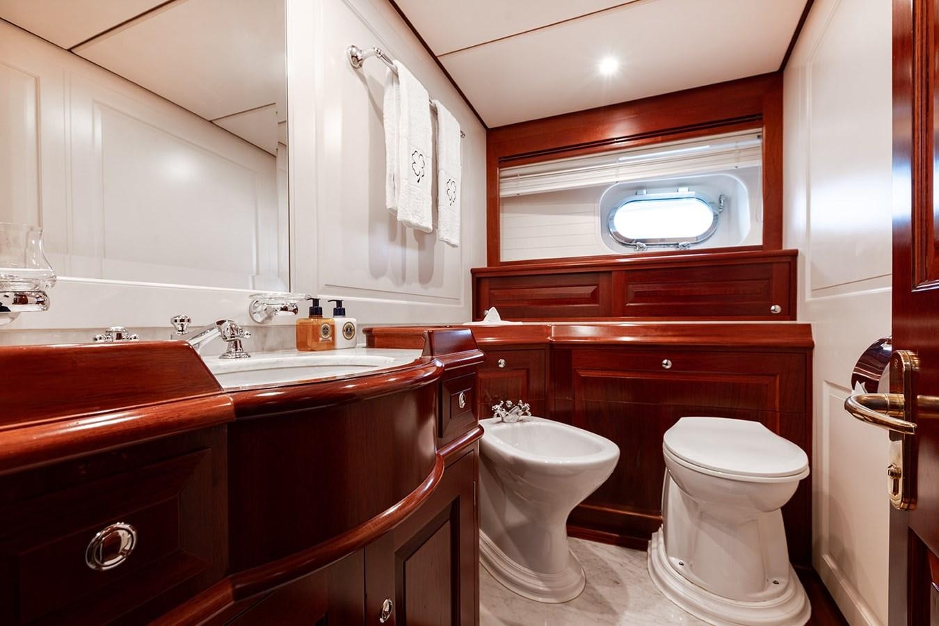 a bathroom with a sink toilet and a bathtub aboard IRELANDA Yacht for Sale