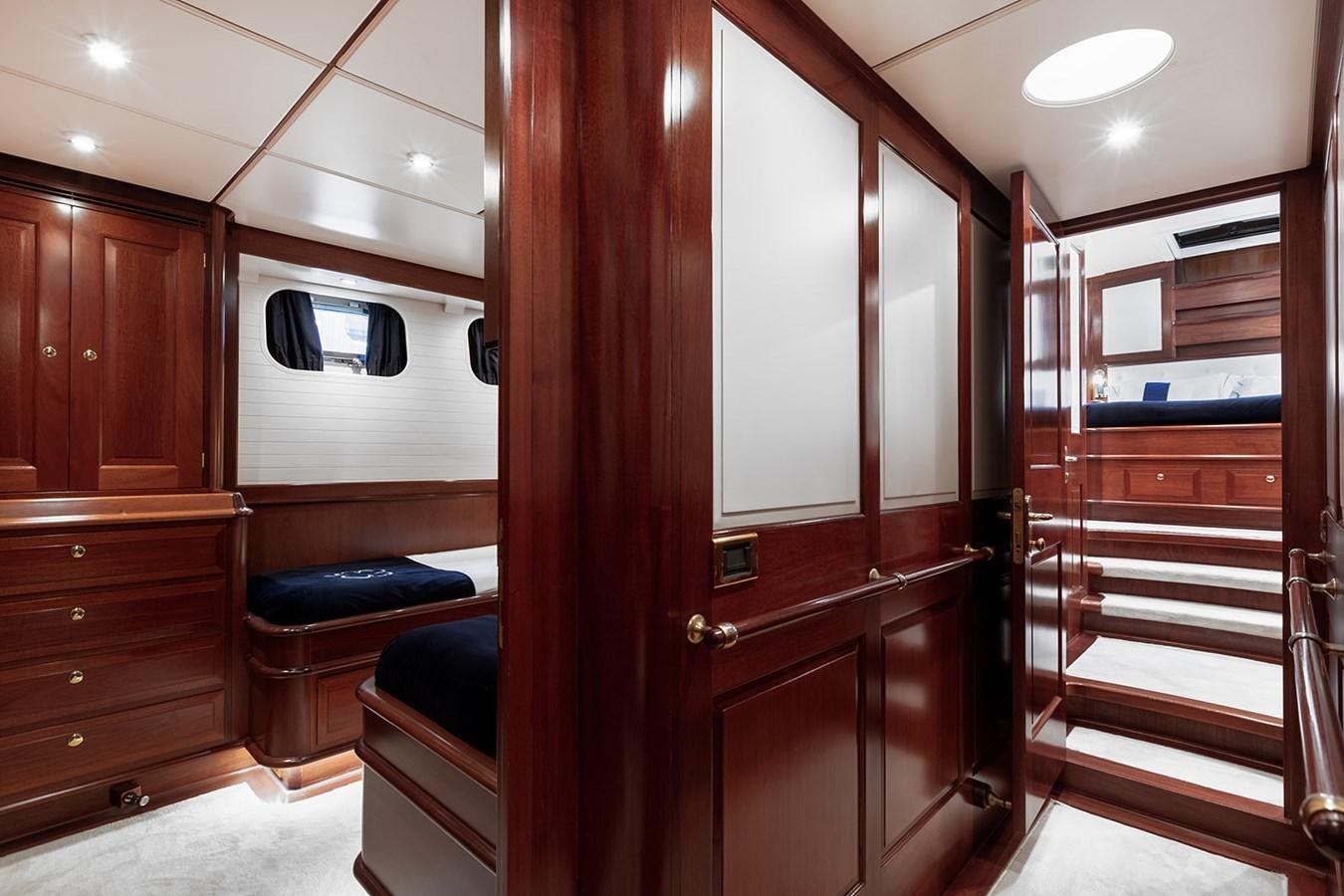 a room with wooden cabinets aboard IRELANDA Yacht for Sale