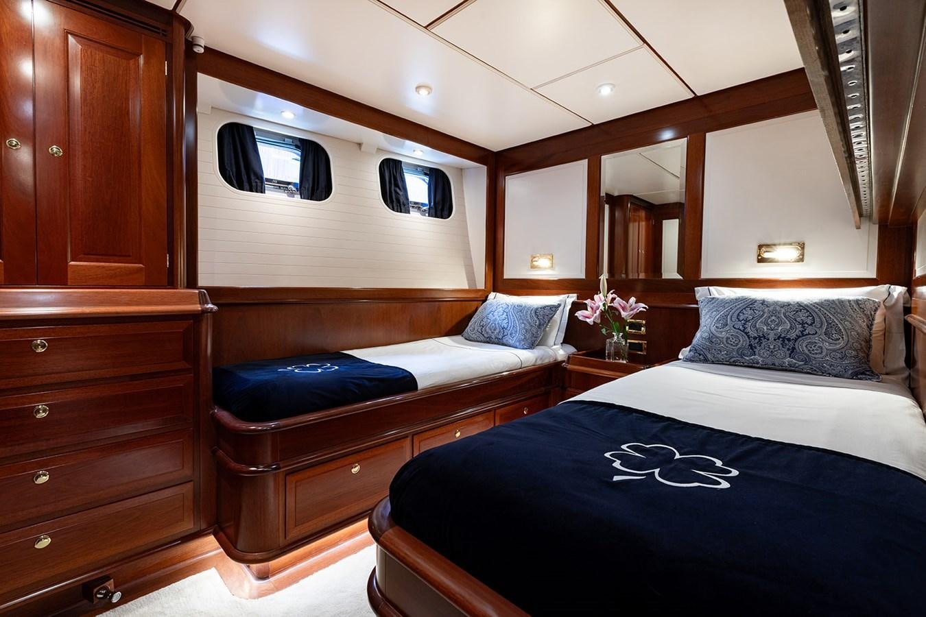a bedroom with a bed and a television aboard IRELANDA Yacht for Sale