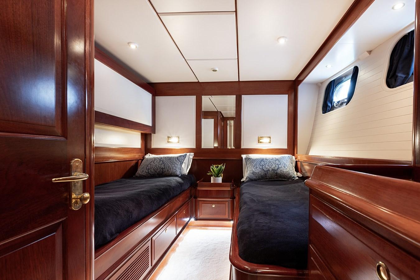 a room with a bed and a tv on the wall aboard IRELANDA Yacht for Sale