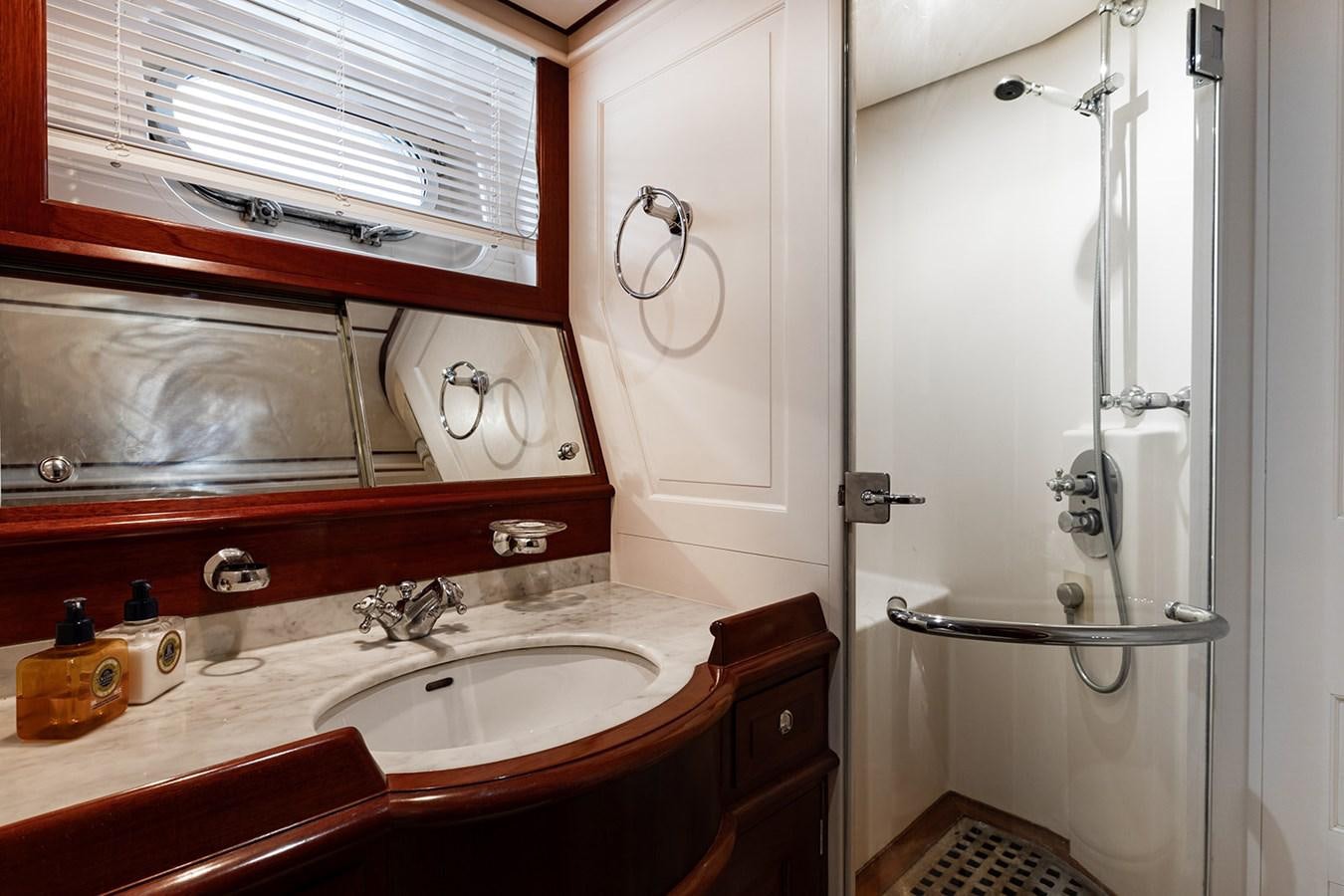 a bathroom with a glass shower door aboard IRELANDA Yacht for Sale