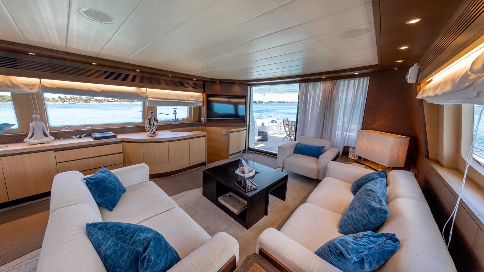 a living room with a large window aboard DOMINIC  2008 MAIORA 27M @ PUERTO AVENTURAS Yacht for Sale