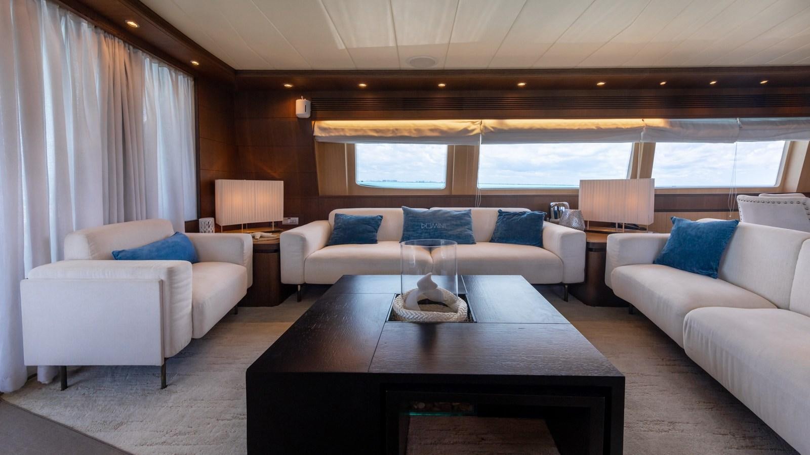 a living room with a couch and a coffee table aboard DOMINIC  2008 MAIORA 27M @ PUERTO AVENTURAS Yacht for Sale