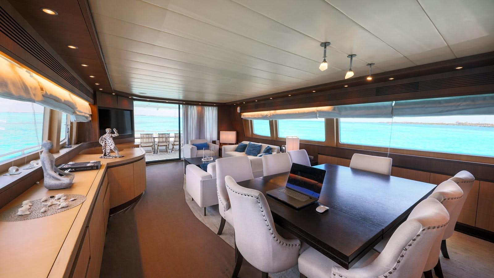 a room with a table chairs and a large window aboard DOMINIC  2008 MAIORA 27M @ PUERTO AVENTURAS Yacht for Sale