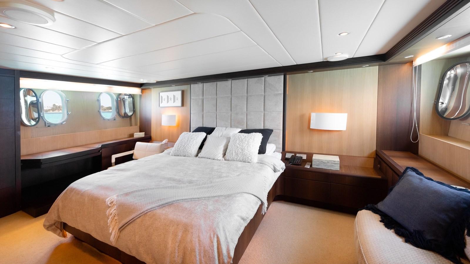 a room with a bed and a television aboard DOMINIC  2008 MAIORA 27M @ PUERTO AVENTURAS Yacht for Sale