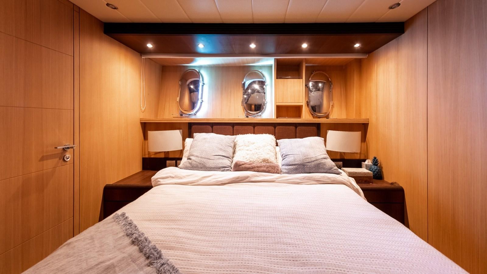 a bed with white sheets aboard DOMINIC  2008 MAIORA 27M @ PUERTO AVENTURAS Yacht for Sale