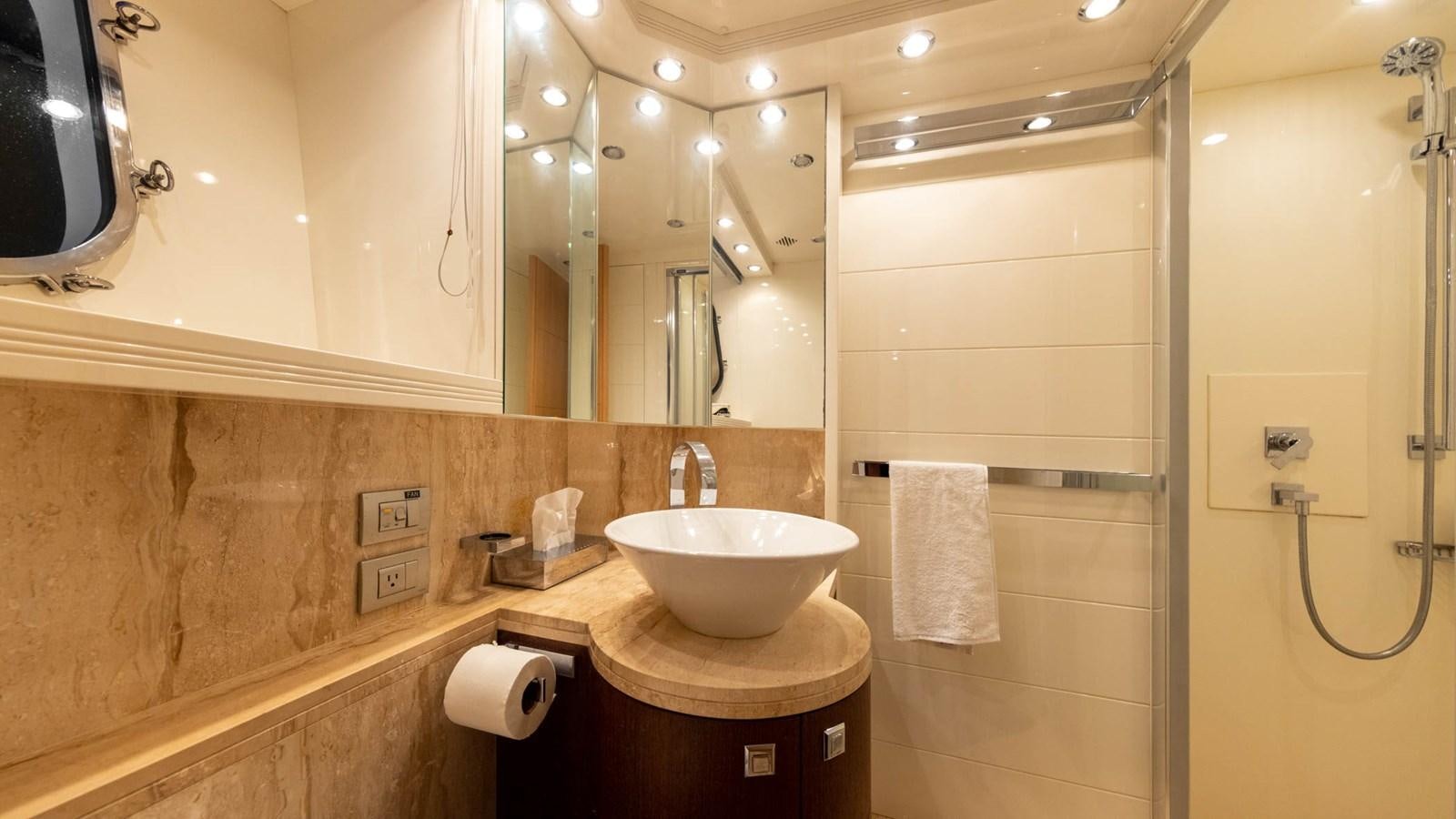 a bathroom with a sink and a mirror aboard DOMINIC  2008 MAIORA 27M @ PUERTO AVENTURAS Yacht for Sale