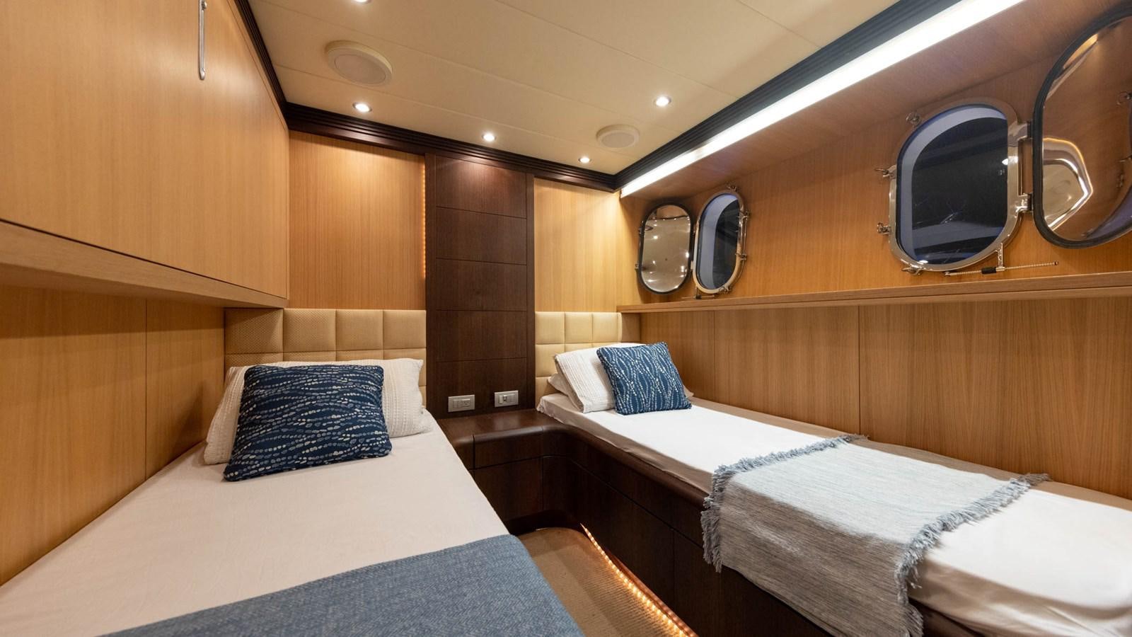 a room with beds and a mirror aboard DOMINIC  2008 MAIORA 27M @ PUERTO AVENTURAS Yacht for Sale