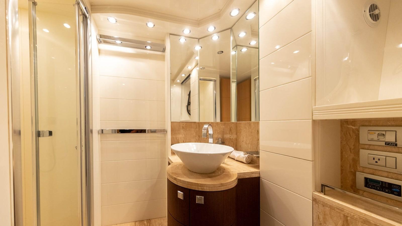 a bathroom with a sink and a mirror aboard DOMINIC  2008 MAIORA 27M @ PUERTO AVENTURAS Yacht for Sale