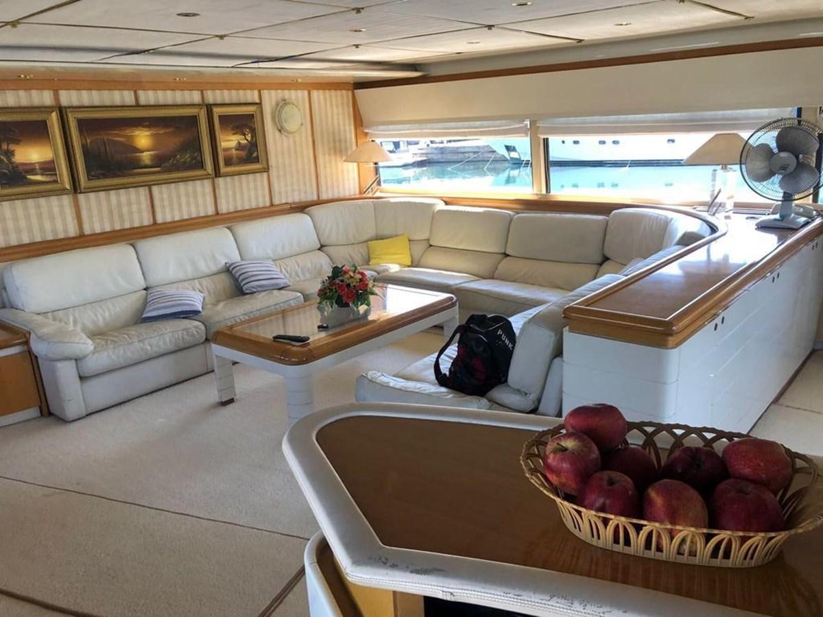a living room with a couch and a table aboard ORYX Yacht for Sale