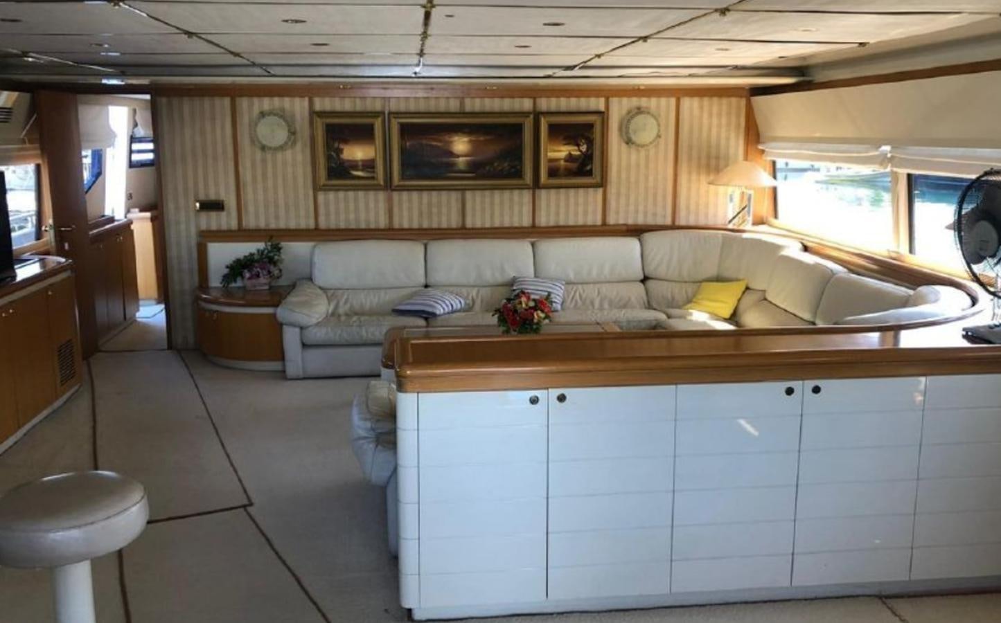 a room with a couch and a table aboard ORYX Yacht for Sale