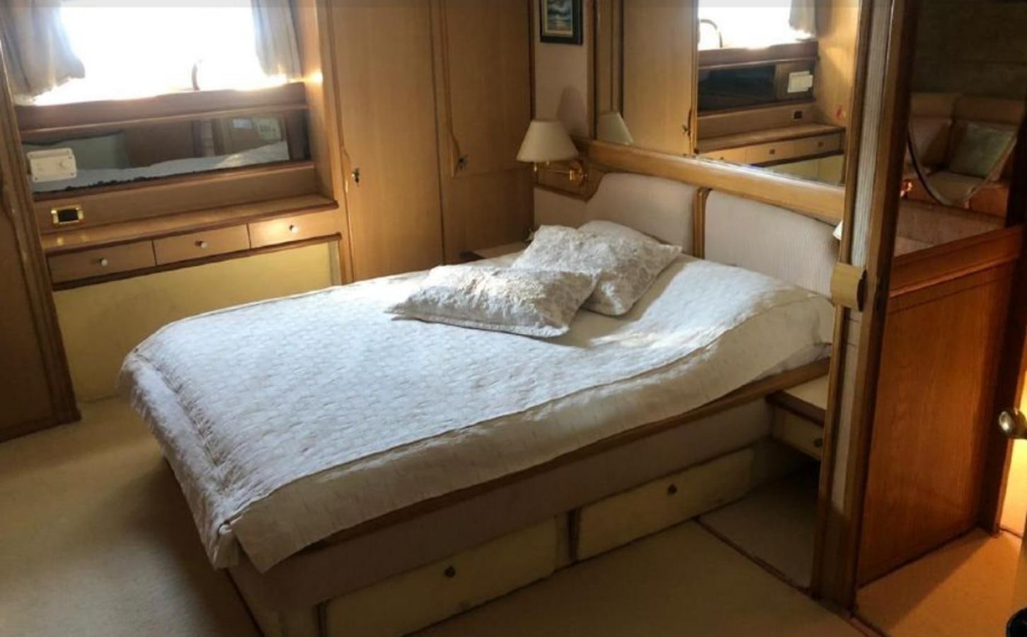 a bed in a room aboard ORYX Yacht for Sale