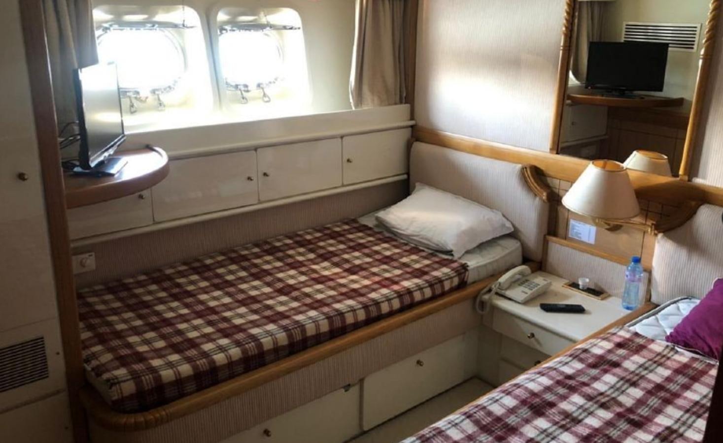 a couple of beds in a room aboard ORYX Yacht for Sale