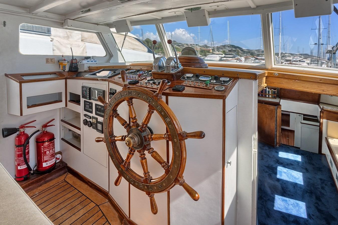 a wooden wheel in a room aboard PHILMARBE - ORTIGOZA COFADIC Yacht for Sale