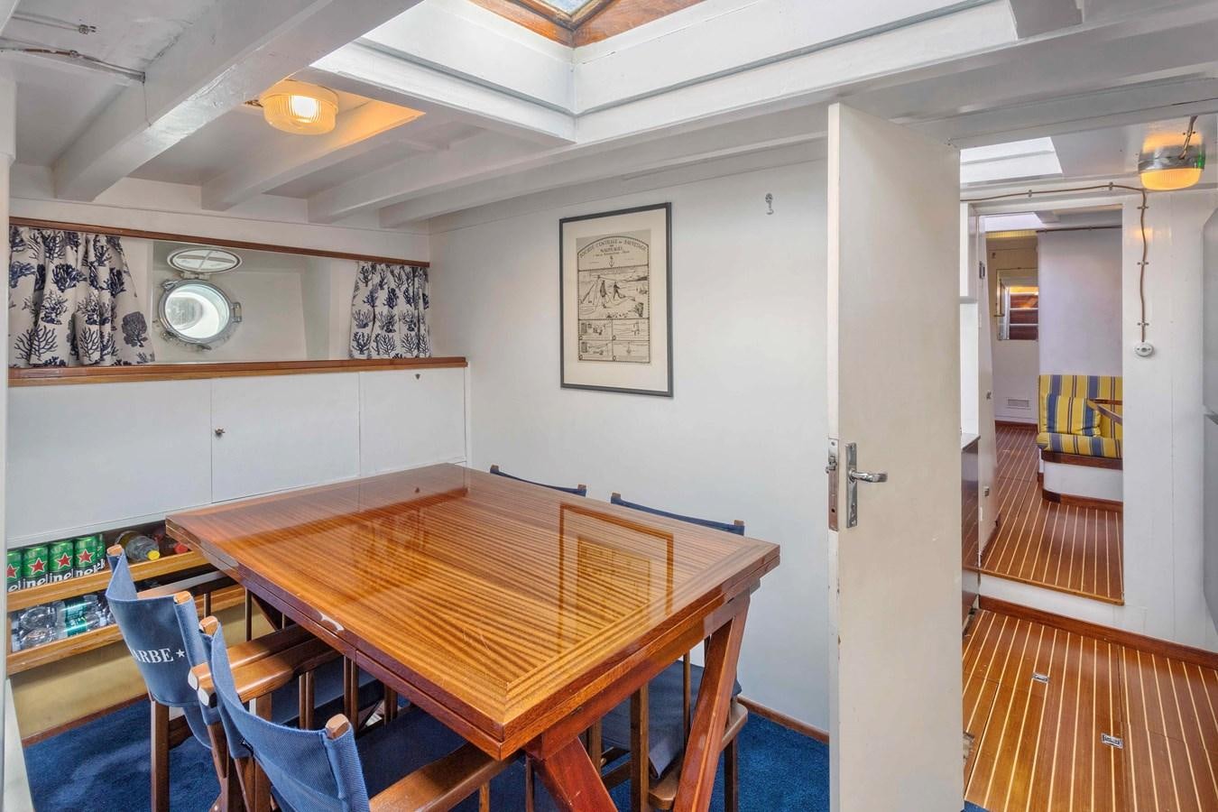 a dining table in a room aboard PHILMARBE - ORTIGOZA COFADIC Yacht for Sale