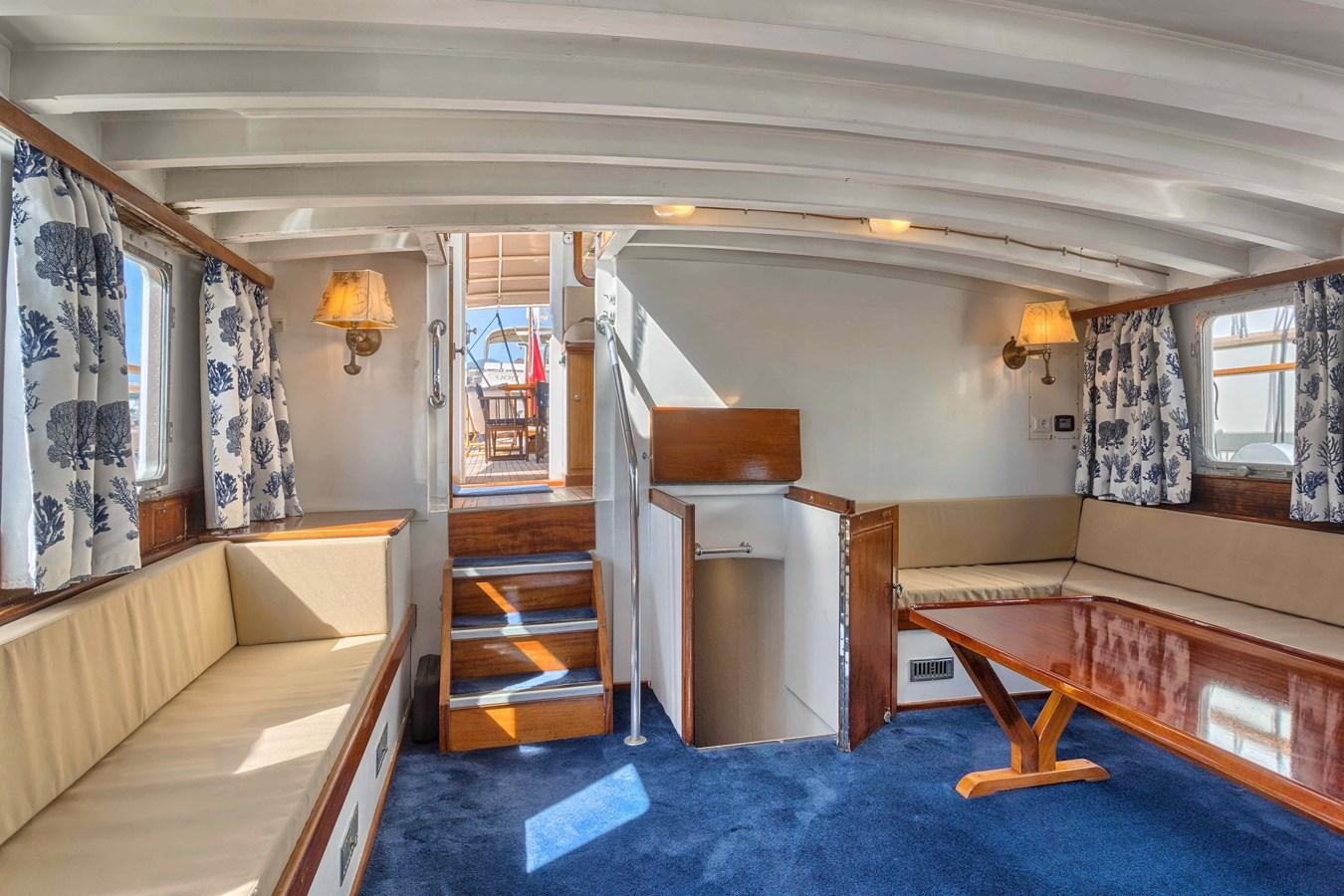 a room with a bed and a desk aboard PHILMARBE - ORTIGOZA COFADIC Yacht for Sale