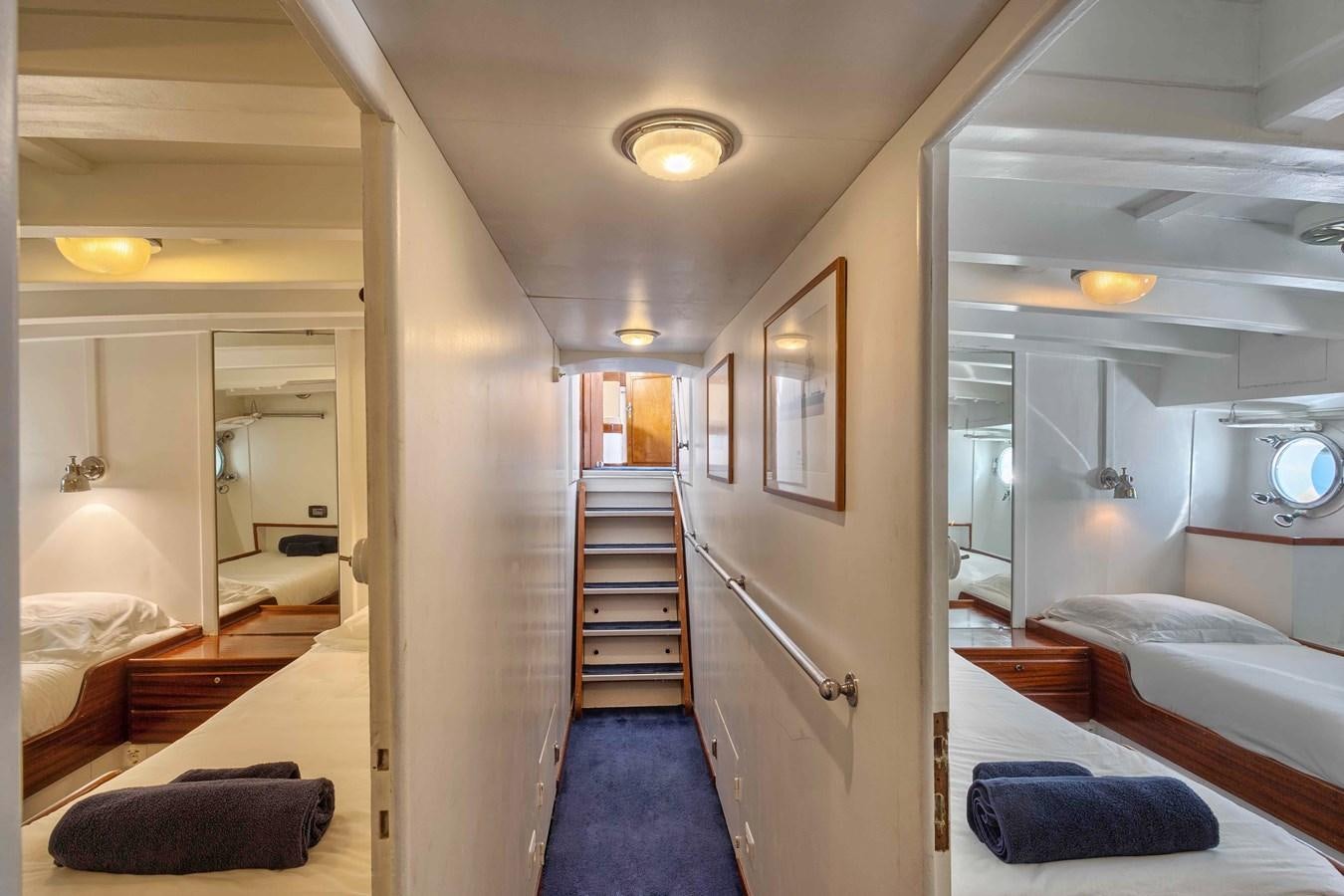 a room with a staircase and a bed aboard PHILMARBE - ORTIGOZA COFADIC Yacht for Sale