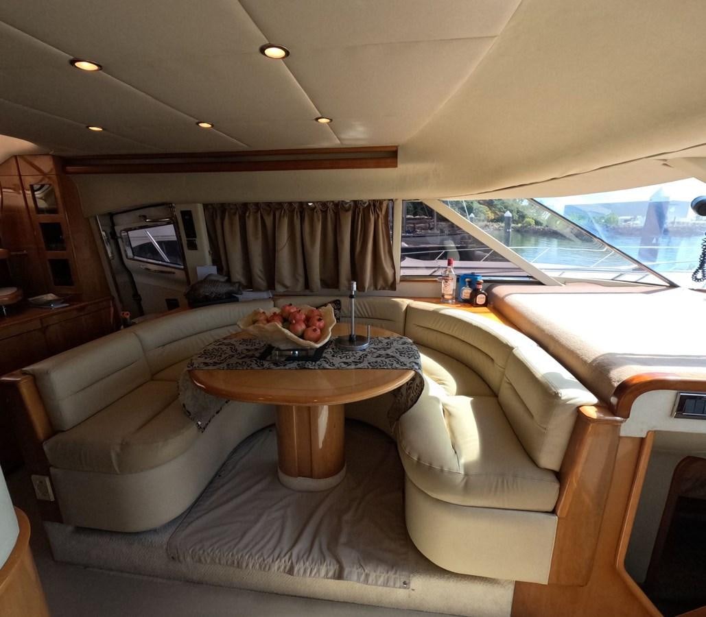 a living room with a large window aboard PYRAMID Yacht for Sale