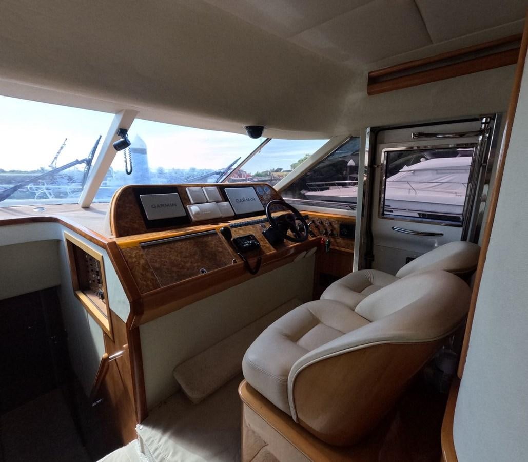 a small cabin with a desk and chairs aboard PYRAMID Yacht for Sale