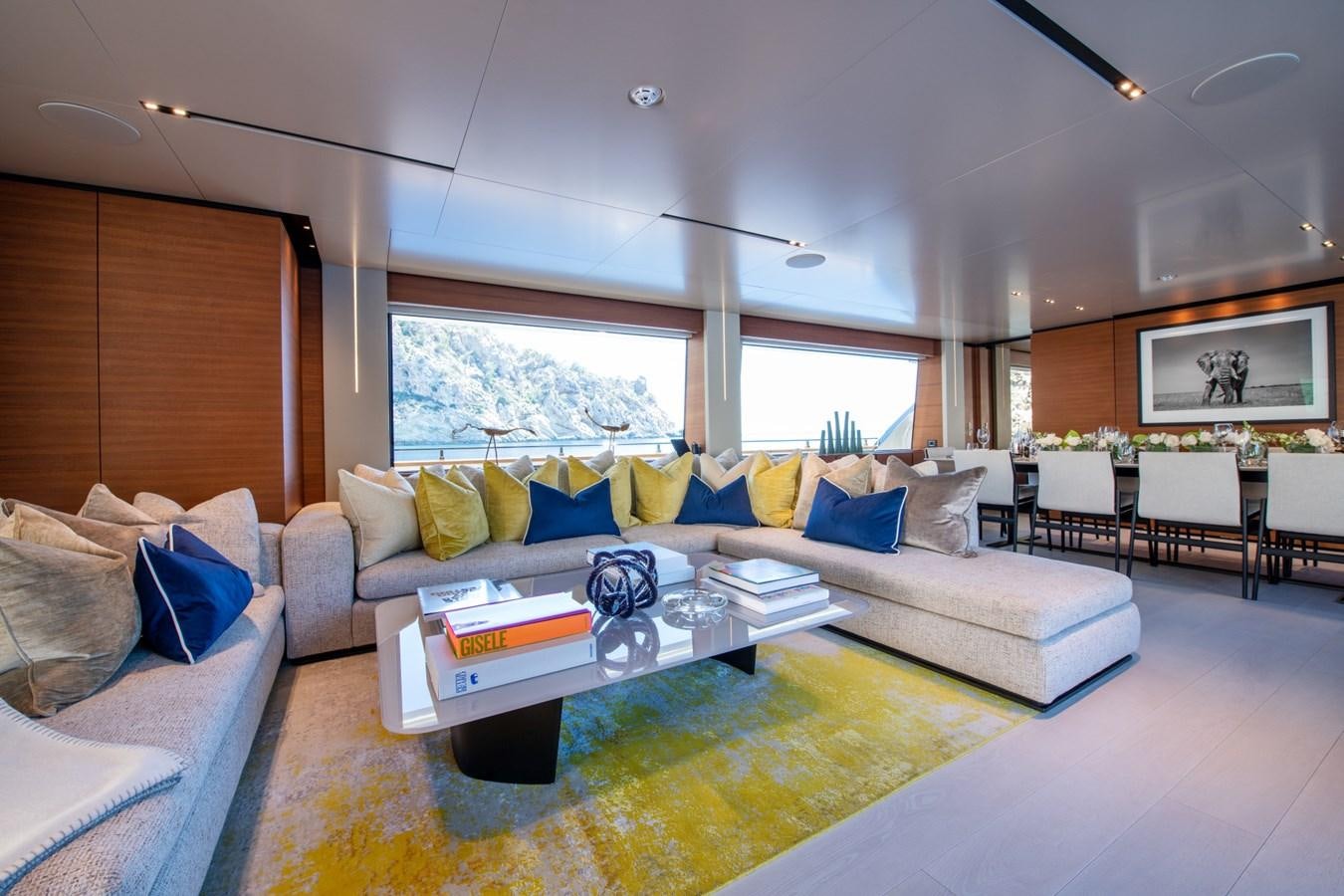 a living room with a couch and a coffee table aboard MAC ONE Yacht for Sale