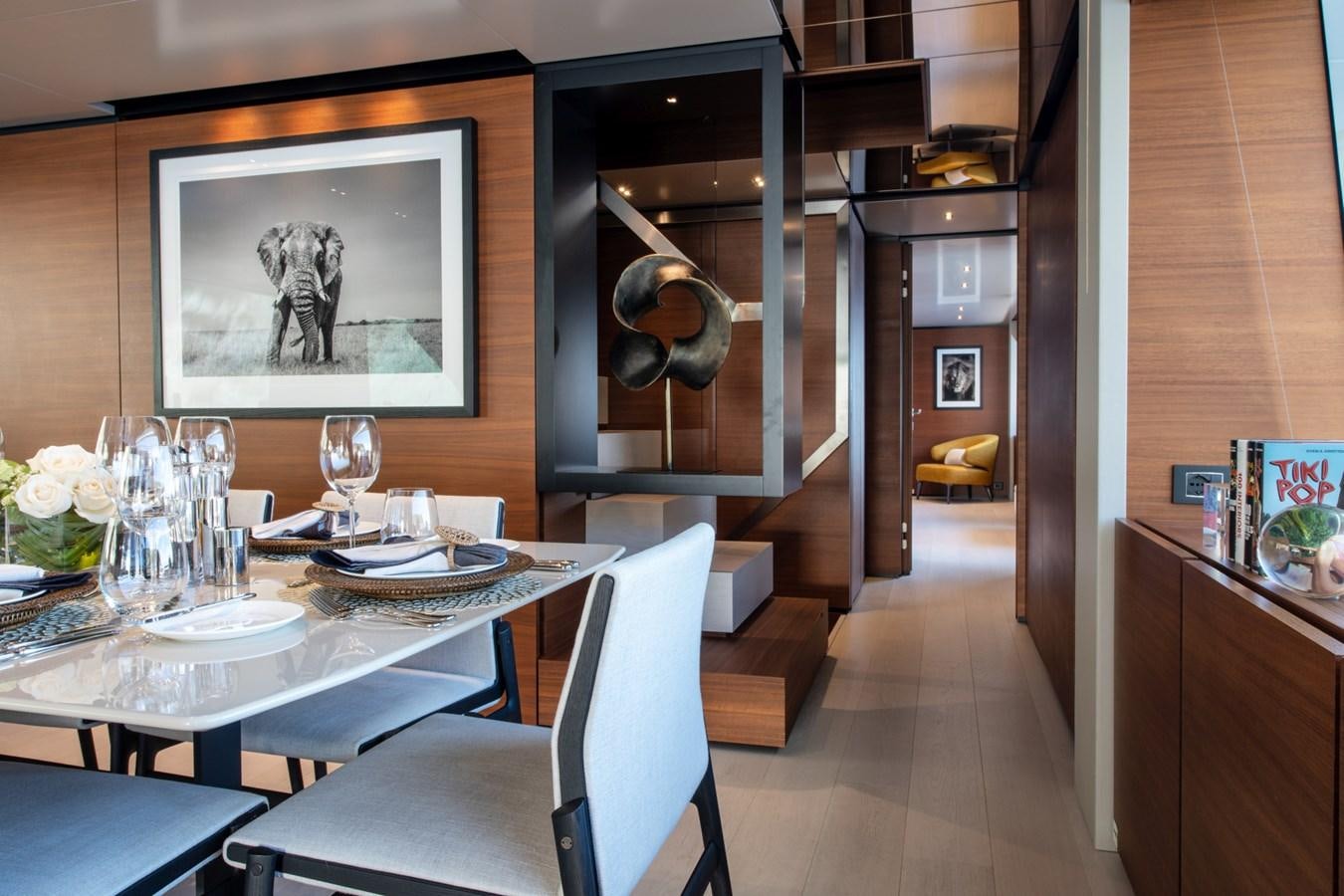a dining room with a table and chairs aboard MAC ONE Yacht for Sale
