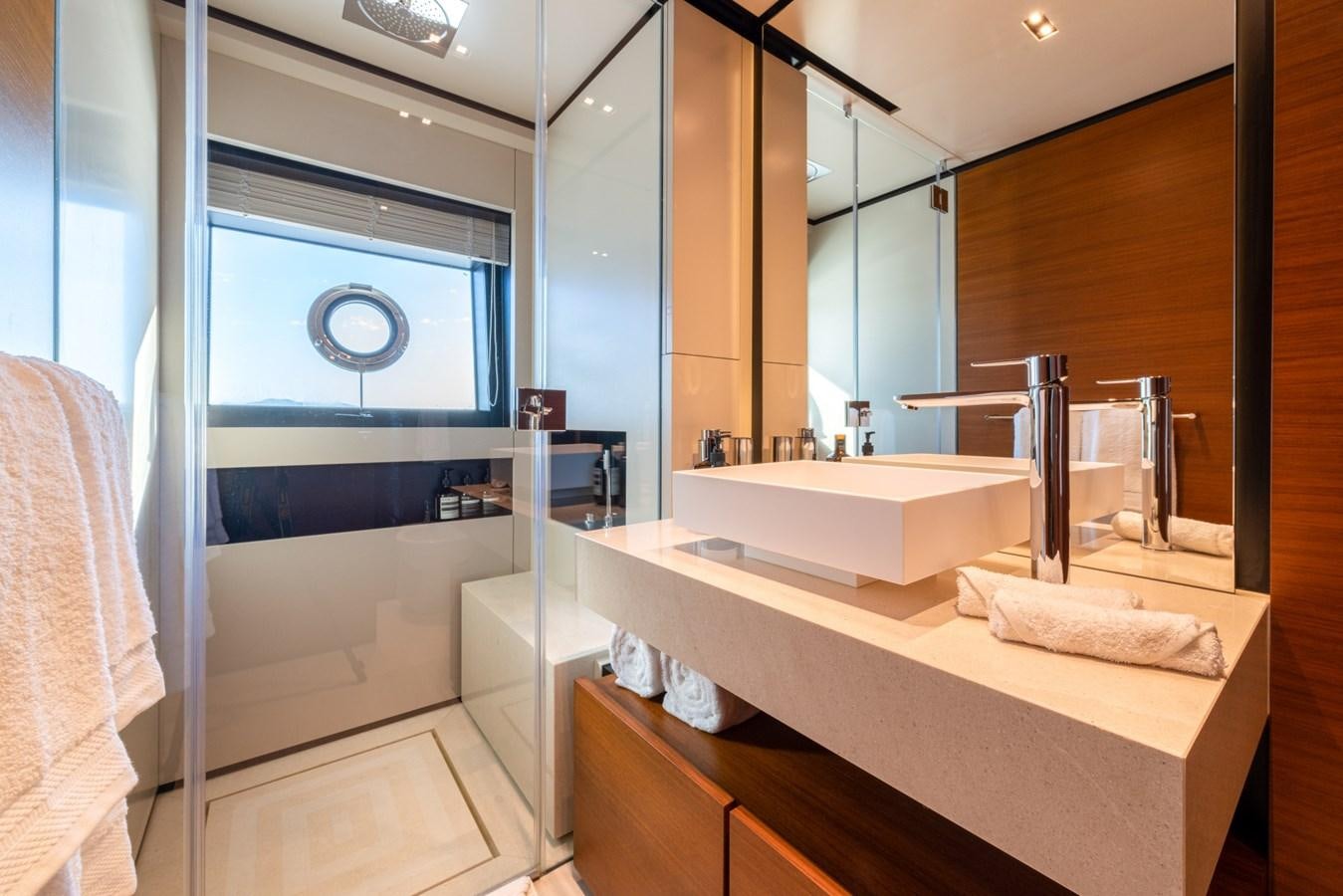 a bathroom with a tub sink and a sink aboard MAC ONE Yacht for Sale