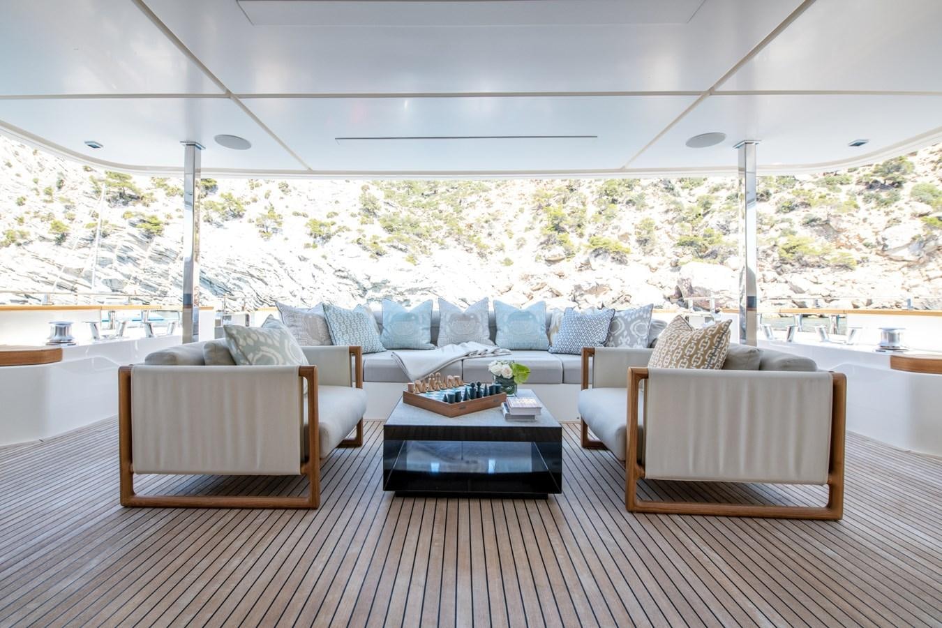 a room with a couch and a table and chairs aboard MAC ONE Yacht for Sale