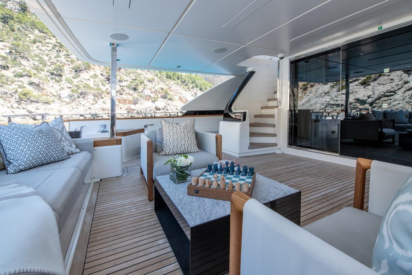 a living room with a large patio aboard MAC ONE Yacht for Sale