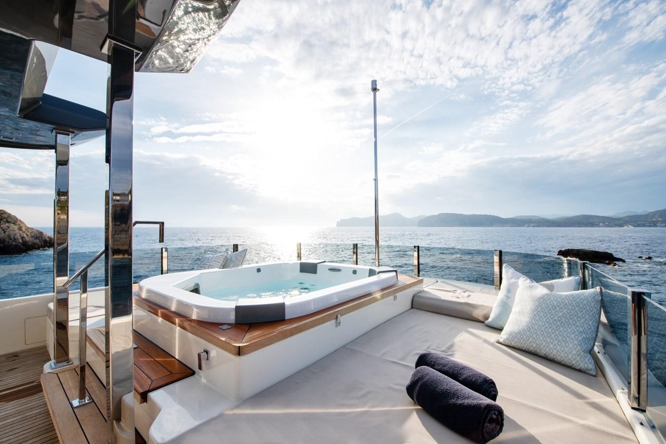 a large white lounge chair on a boat in the water aboard MAC ONE Yacht for Sale