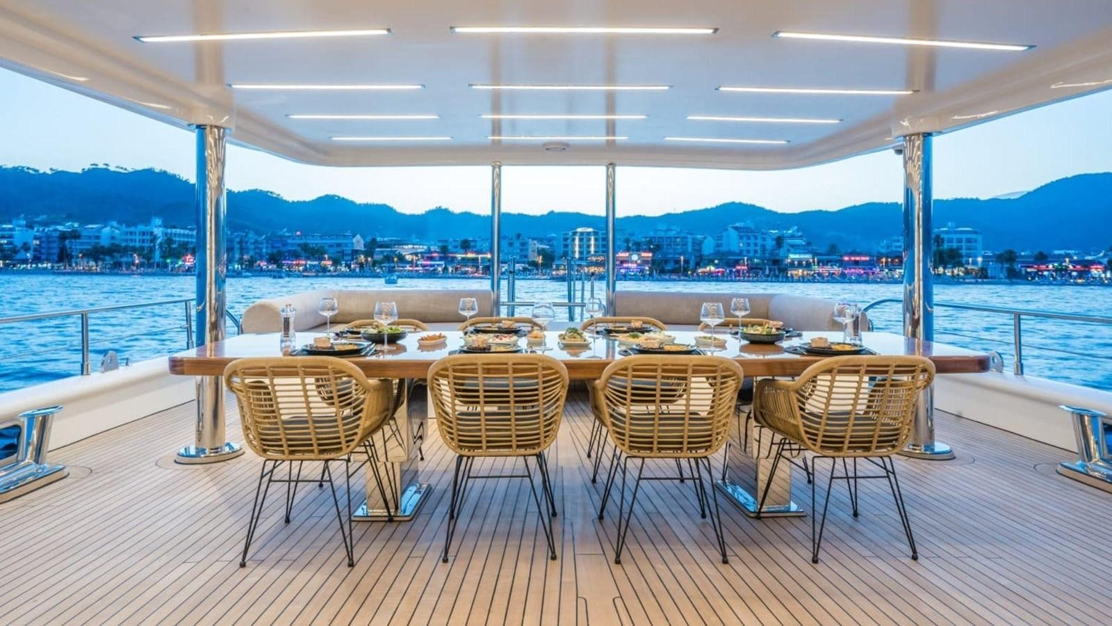 a room with tables and chairs aboard 39,1 M CUSTOM BUILD MOTOR Yacht for Sale