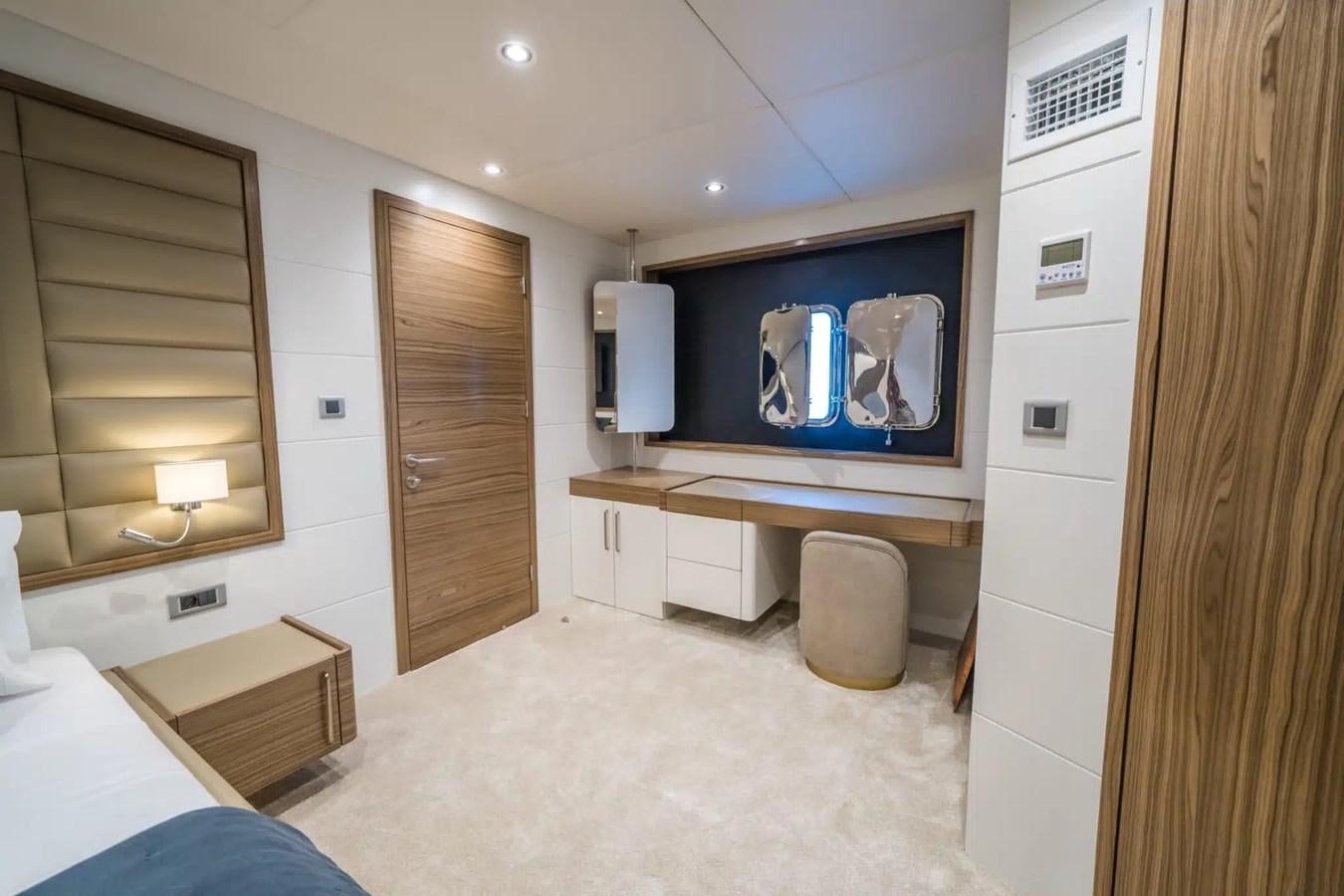 a room with a tv and a bed aboard 39,1 M CUSTOM BUILD MOTOR Yacht for Sale