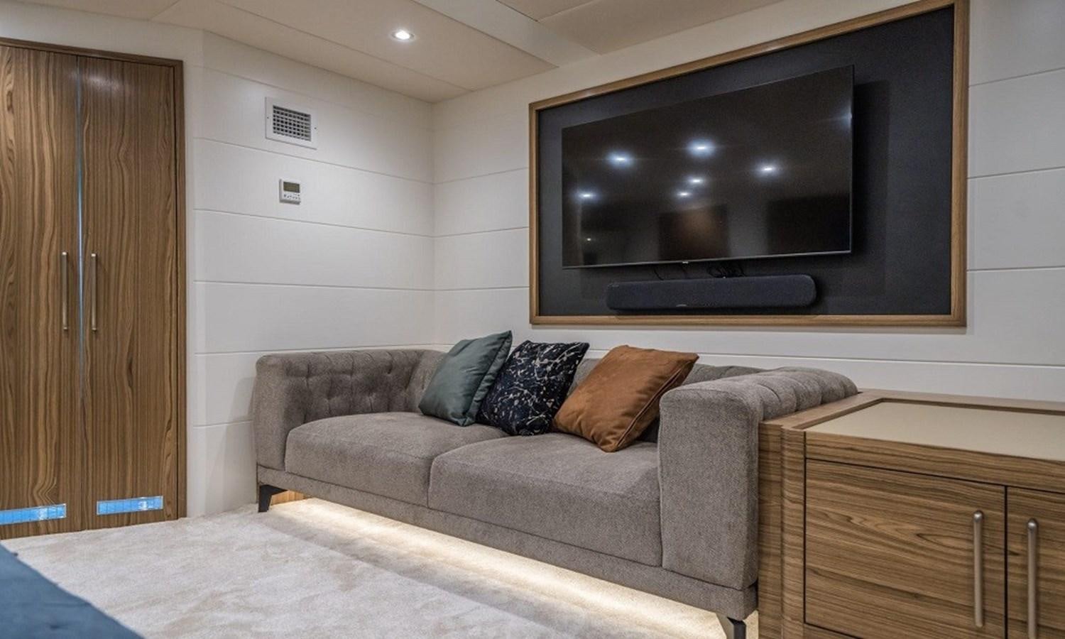 a living room with a couch and tv aboard 39,1 M CUSTOM BUILD MOTOR Yacht for Sale