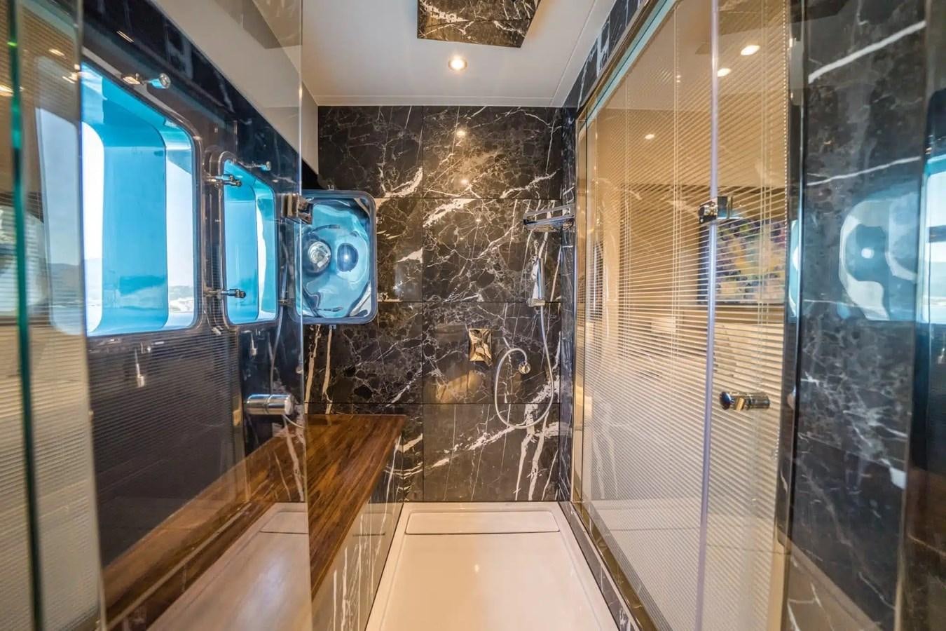 a bathroom with a large mirror aboard 39,1 M CUSTOM BUILD MOTOR Yacht for Sale
