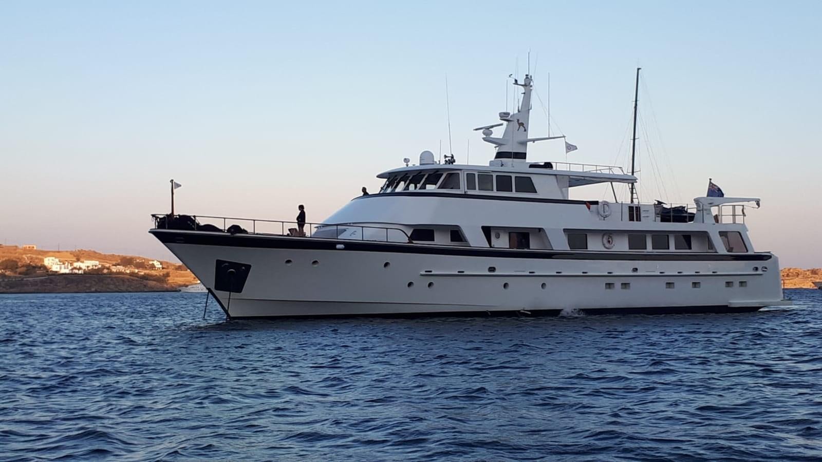 a white yacht in the water aboard HAPPY Yacht for Sale