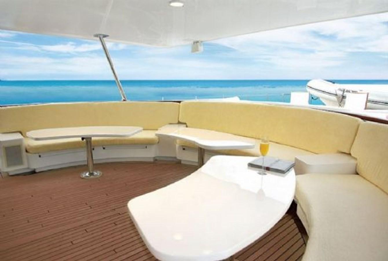 a room with a bed and a table aboard HAPPY Yacht for Sale