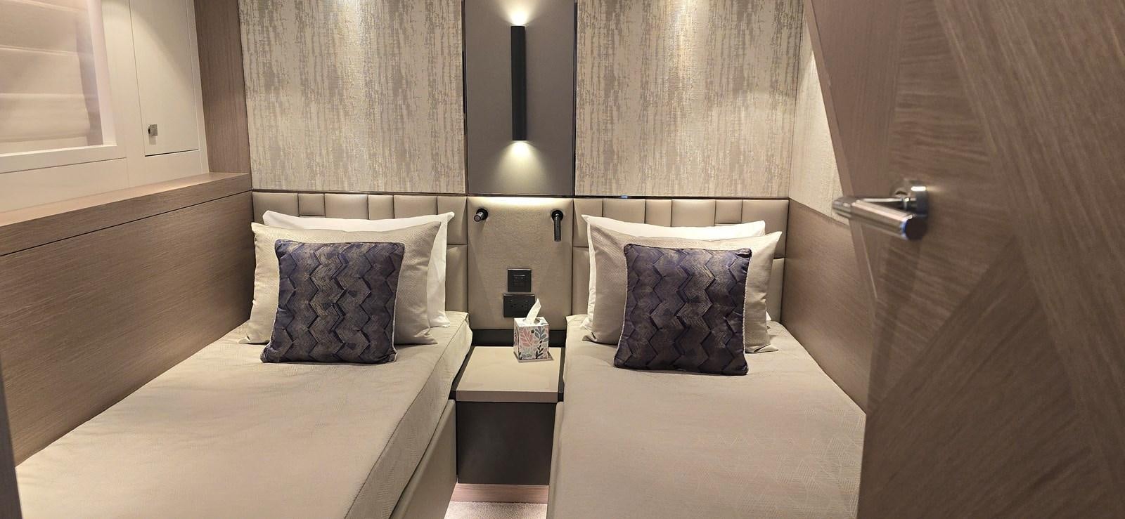 a room with two beds aboard GABY Yacht for Sale