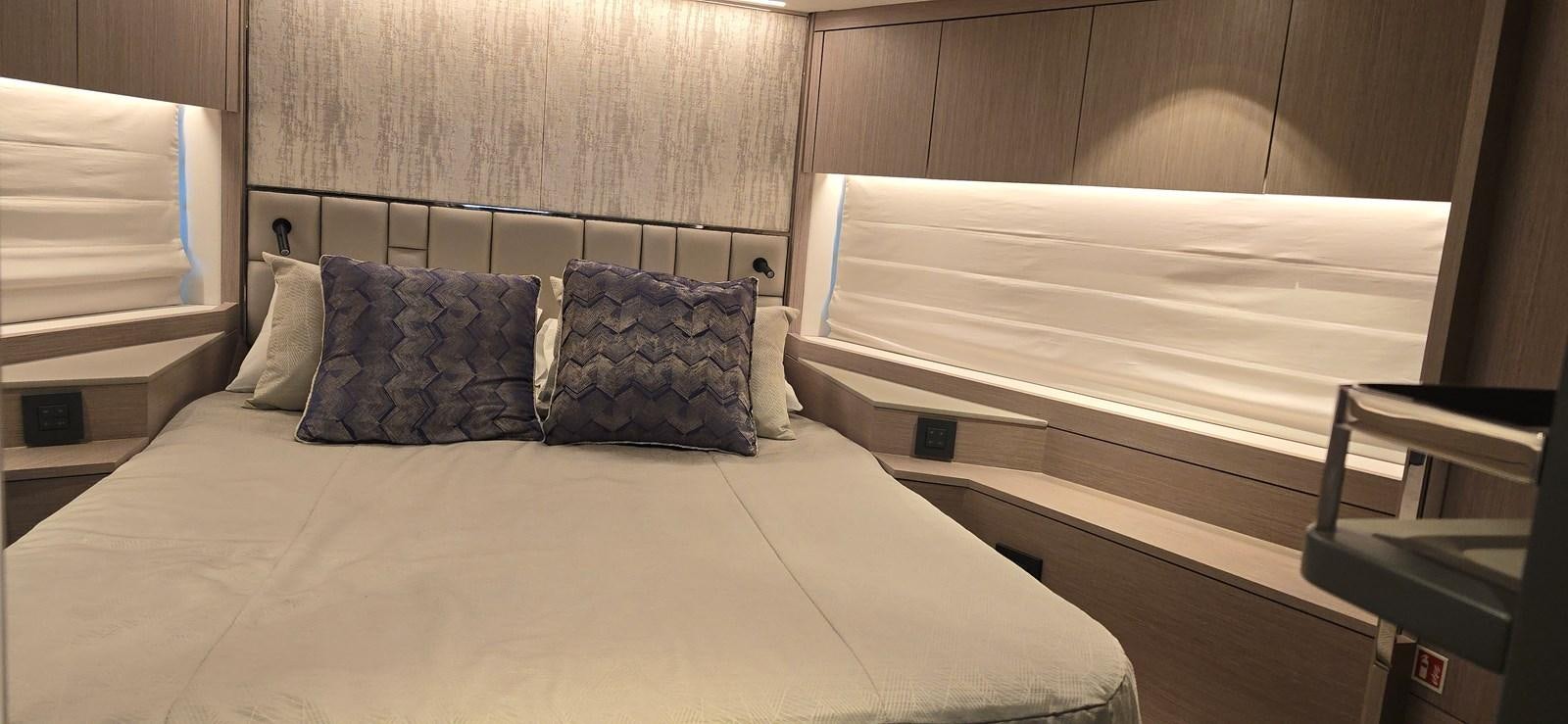 a bed with pillows aboard GABY Yacht for Sale