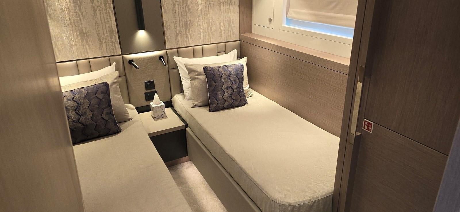 a room with two beds aboard GABY Yacht for Sale