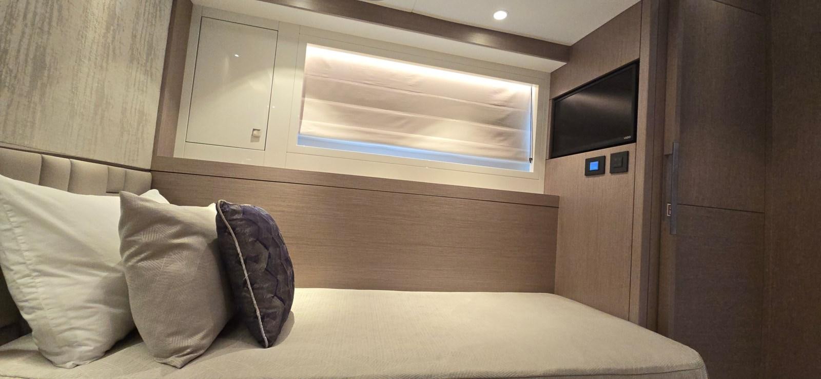 a bed with a backpack on it aboard GABY Yacht for Sale