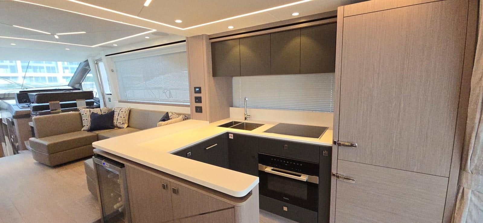 a kitchen with a couch and a sink aboard GABY Yacht for Sale