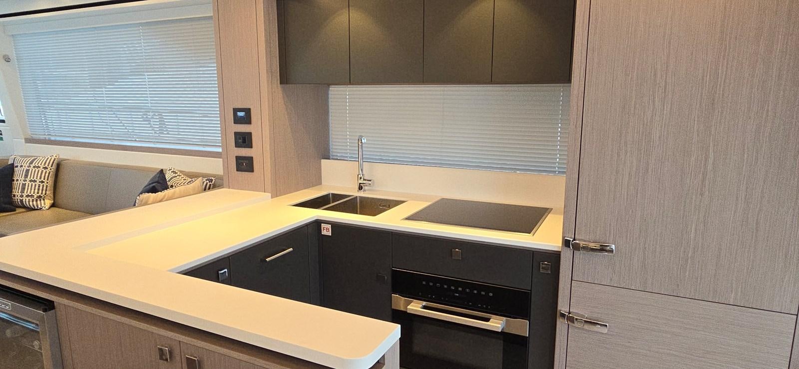 a room with a bed and a sink aboard GABY Yacht for Sale