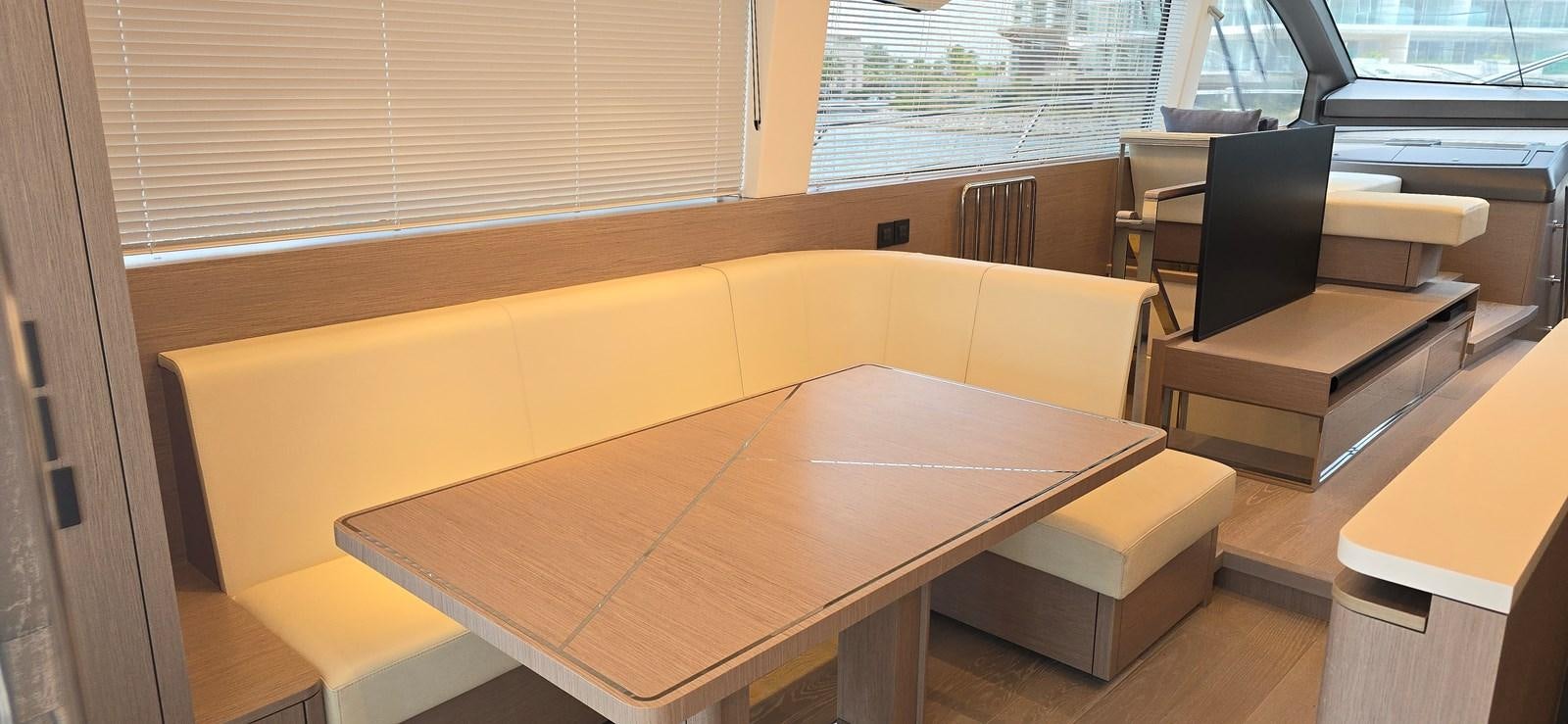 a room with desks and chairs aboard GABY Yacht for Sale