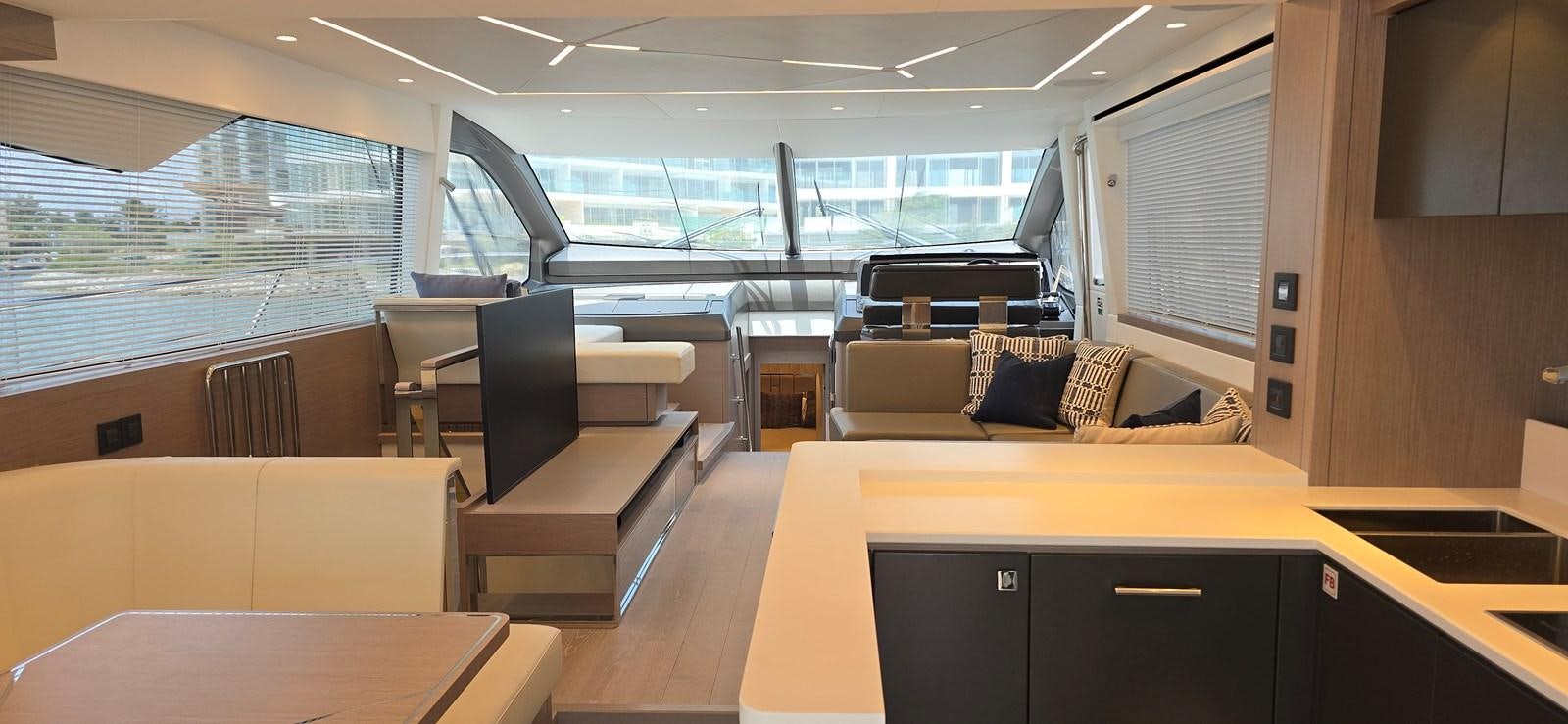 a room with a couch and a table and a window aboard GABY Yacht for Sale