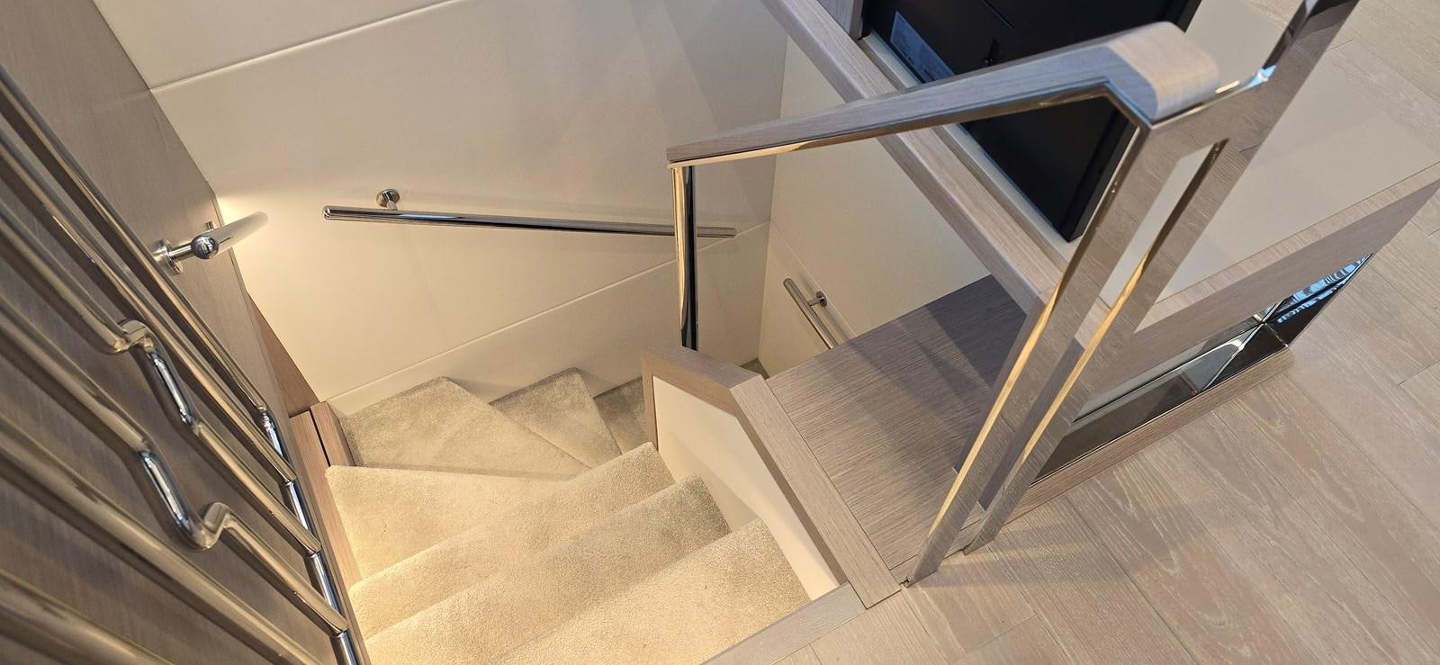 a staircase with a glass door aboard GABY Yacht for Sale