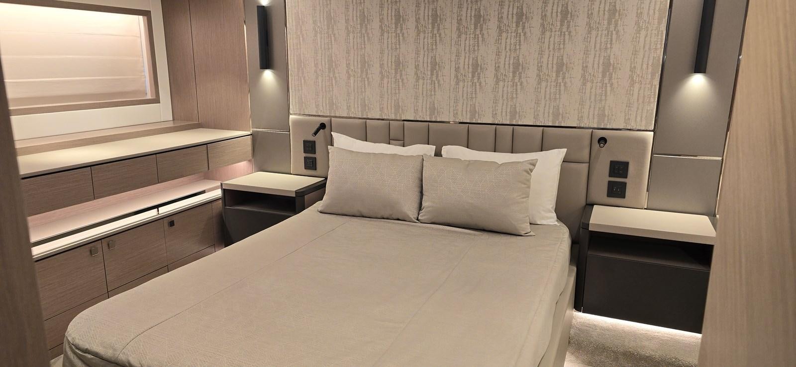 a bed with white sheets aboard GABY Yacht for Sale